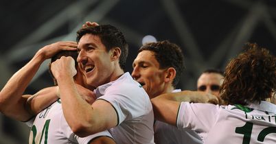 Cox: Mobbed by team-mates after goal